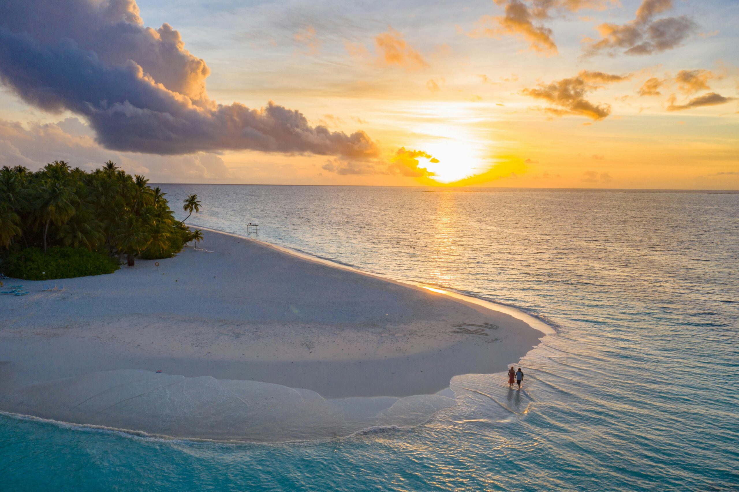 Couple relaxing in luxury resort in Bora Bora obtained via travel rewards program