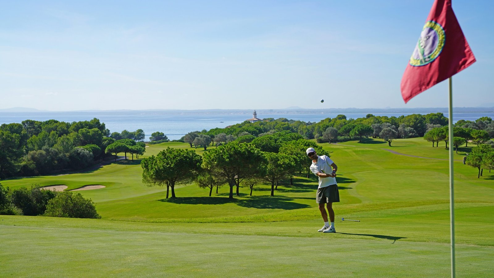 A scenic view of a world-famous golf course with lush greens and ocean views