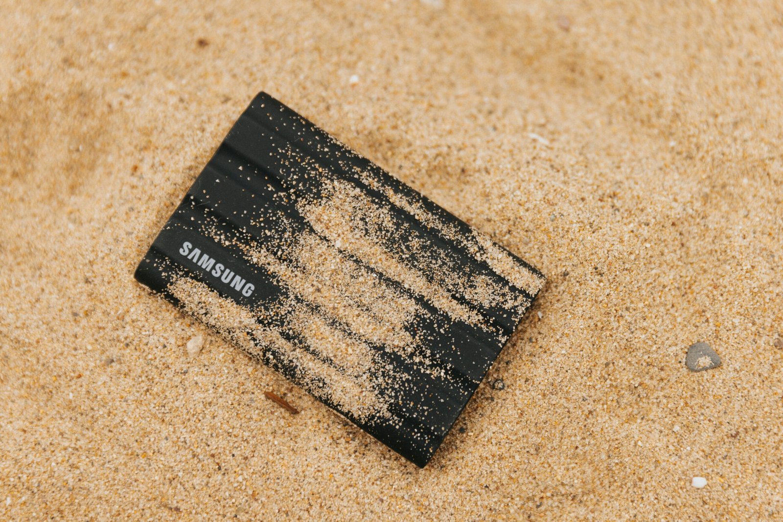A sleek black metal credit card lying on a marble surface