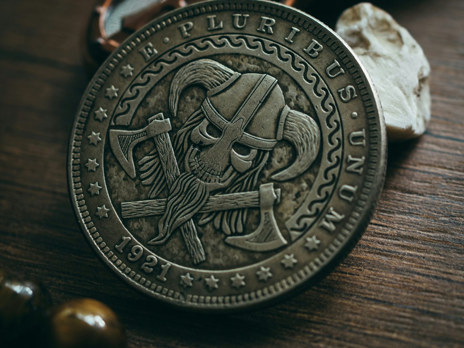a pirate coin sitting on top of a wooden table