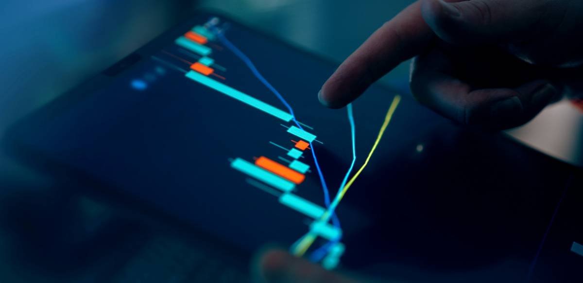 Sleek metal credit card resting on a marble counter next to smartphone.